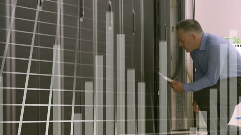 Businessman Analyzing Data in Server Room Environment