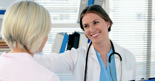 Friendly Female Doctor Consulting Patient in Office - Download Free Stock Images Pikwizard.com