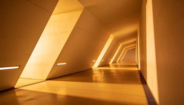 Angled Corridor Casting Diagonal Light and Geometric Shadows in Futuristic Interior