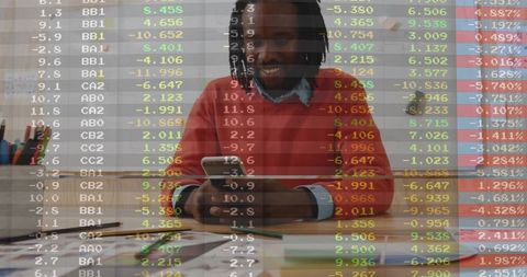 Man in office using smartphone with stock data overlay