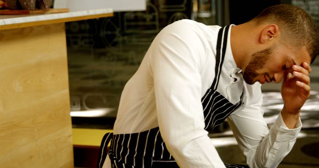 Stressed Restaurant Worker Wearing Apron Taking Break - Download Free Stock Images Pikwizard.com