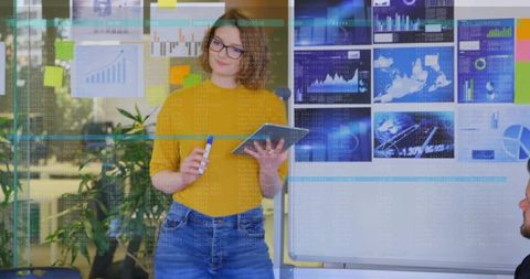 Confident Businesswoman Analyzing Charts in Modern Meeting