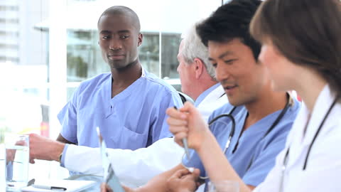 Diverse Medical Team Collaborating in Modern Office