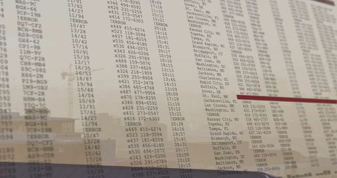 Flight Schedule on Semitransparent Board at Busy Airport
