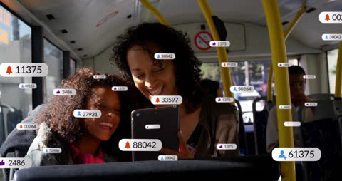 Mother and Daughter Using Smartphone with Social Media Notifications