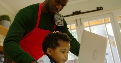 Father and Child Bonding in Kitchen with Laptop - Download Free Stock Images Pikwizard.com