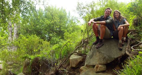 Happy Couple Relaxing on Rock During Forest Hike with Copy Space - Download Free Stock Images Pikwizard.com