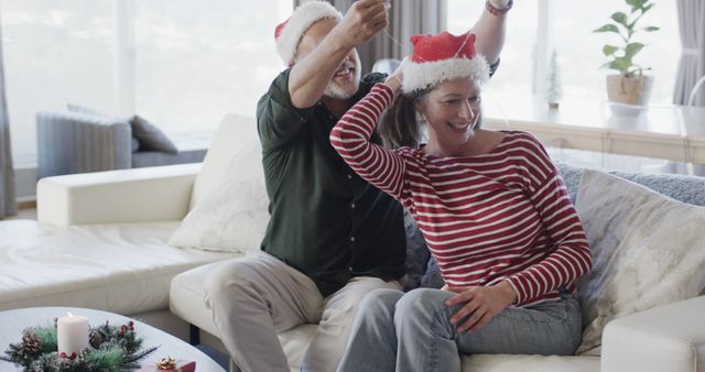 Happy Elderly Couple Celebrating Christmas at Home - Download Free Stock Images Pikwizard.com