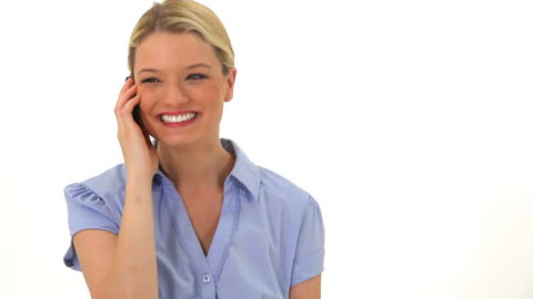 Happy Woman Smiling While Talking on Mobile Phone
