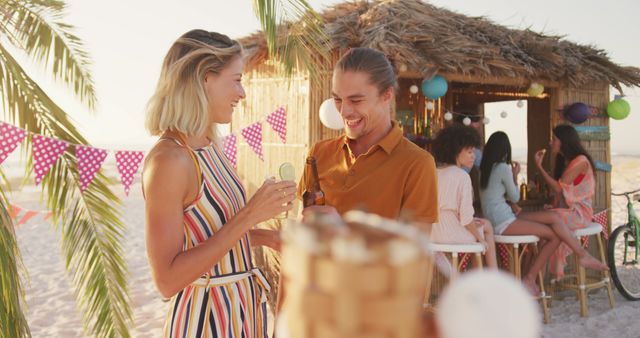 Friends Enjoying Beach Party with Refreshments at Sunset - Download Free Stock Images Pikwizard.com