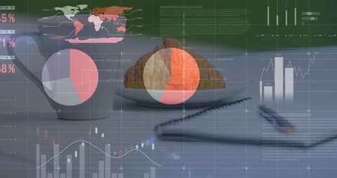 Croissant and coffee on workspace desk overlaid with financial charts, analytics graphs, world map