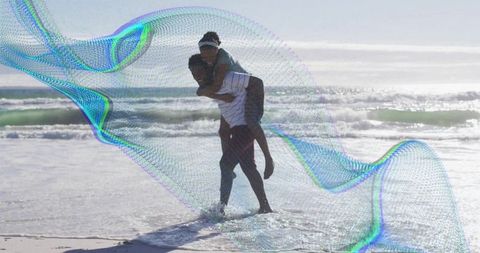 Couple enjoying beach adventure with creative digital overlay