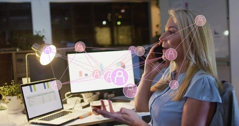 Businesswoman Talking on Phone Managing Remote Team with Network Overlay and Analytics