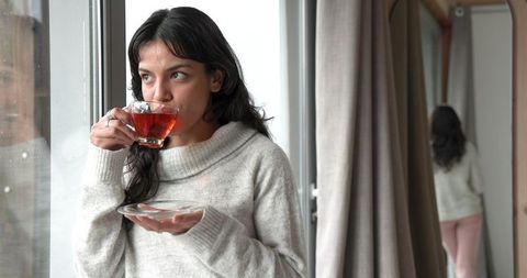 Cozy Lifestyle with Glass Teacup by a Large Window