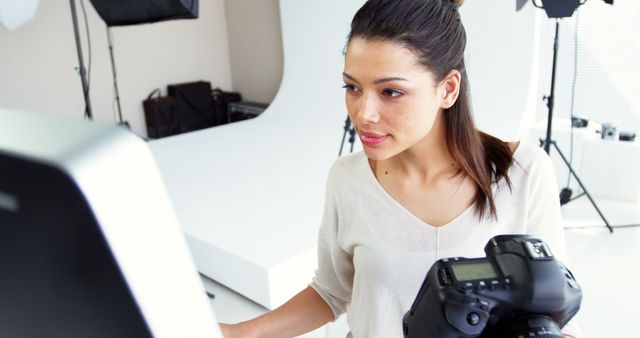 Female Photographer Editing Photos in Studio - Download Free Stock Images Pikwizard.com