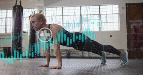 Woman planking in gym with data graph overlay for fitness analytics and training