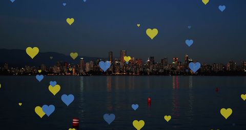 Yellow and Blue Hearts Over City Skyline Night View - Download Free Stock Images Pikwizard.com