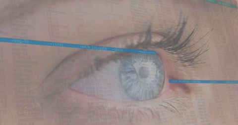 Close-up of blue eye with seamless digital data overlay