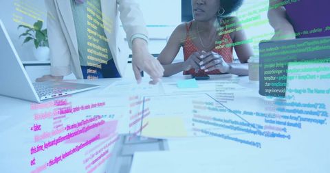Diverse Businesswomen Analyzing Financial Data with Technology Overlay