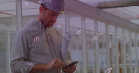 Architect Using Smartphone with Floating Alphabets in Office - Download Free Stock Images Pikwizard.com