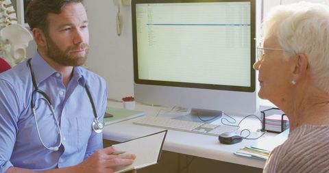 Doctor Consults Senior Woman in Retirement Home During Pandemic