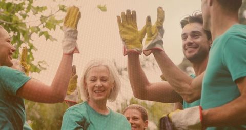 Smiling volunteers celebrating successful conservation effort