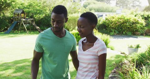 Couple Taking Selfie in Lush Garden on Sunny Day