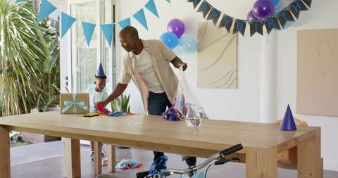 Family decorating for birthday celebration at home