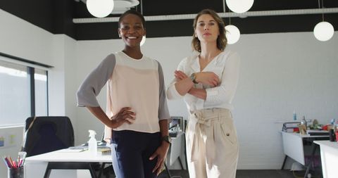 Confident colleagues smiling in modern office environment