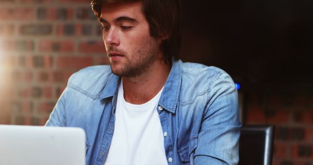 Young Caucasian Man Working on Laptop in Cafe - Download Free Stock Images Pikwizard.com