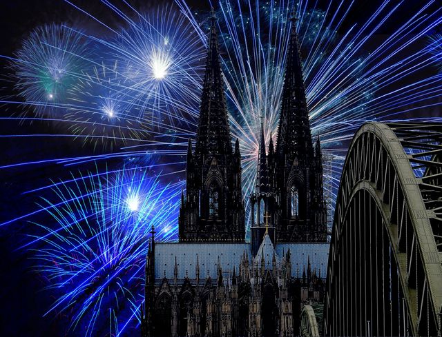 Gorgeous fireworks exploding over a historic cathedral and bridge under a dark night sky. Perfect for illustrating festive events, celebrations, New Year parties, and joy-filled occasions. Can be used for event advertisements, celebration cards, city festivities promotions, or as a vibrant wall art piece.