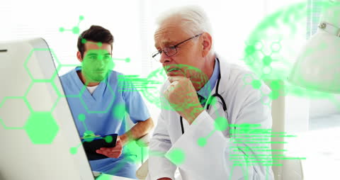 Doctors Analyzing Data on Computer Screen with Digital Interface