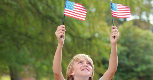 Child Celebrating Patriotism with American Flags Outdoors - Download Free Stock Images Pikwizard.com
