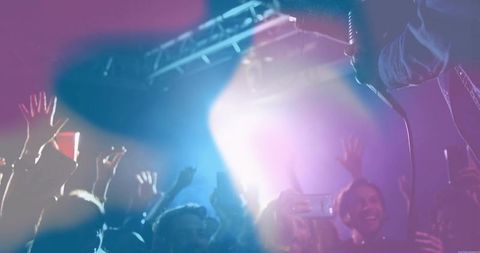 Crowd Capturing Epic Concert Moments with Phones Raised