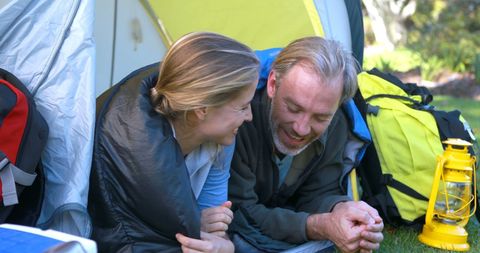 Couple Camping in Park Enjoying Outdoor Adventure