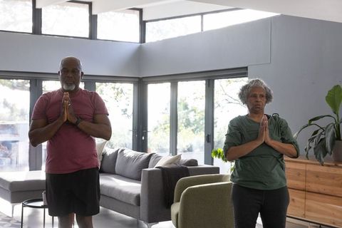 Senior African American Couple Practicing Meditation at Home