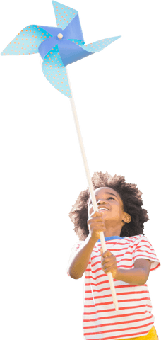 Joyful child holding bright colorful pinwheel outdoors transparent background