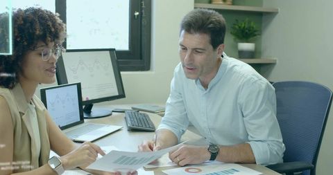 Collaborative Team Analyzing Business Data Reports