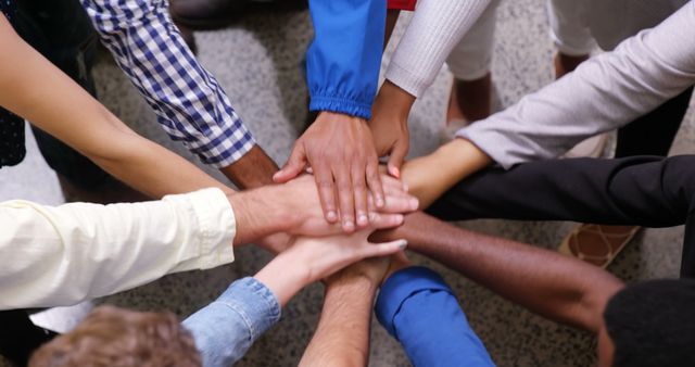 Diverse Team United with Hands Stacked - Download Free Stock Images Pikwizard.com