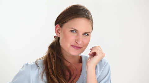 Playful Woman Smiling and Flirting in Studio