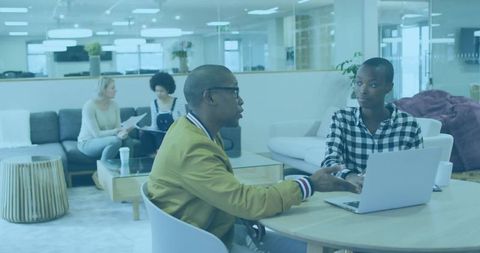 Professional collaboration in cozy office lounge enhancing teamwork