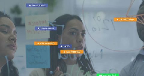 Team collaborating around glass board with sticky notes and social notifications overlay