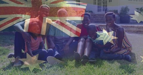 Multigenerational family enjoying sunny backyard picnic with australian flag overlay