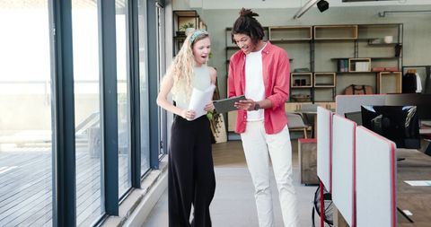 Employees Collaborating Confidently in Modern Office Setting
