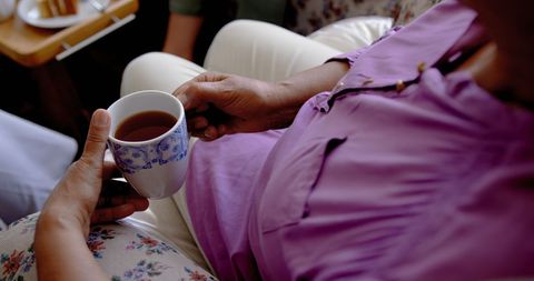 Senior Woman Enjoying Coffee Break at Nursing Home