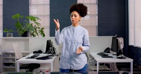 Confident African American Businesswoman Presenting in Modern Office