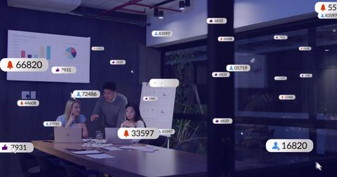 Diverse business team analyzing social media engagement in modern office