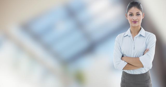 Digital composite of Confident businessman with arms crossed in office