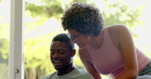 Joyful African American Couple Connecting Indoors