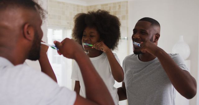 Joyful Family Brushing Teeth Together in Bathroom - Download Free Stock Images Pikwizard.com